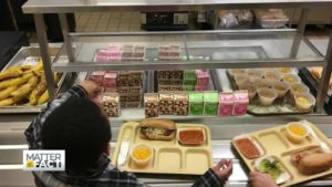 kid in a buffet food line
