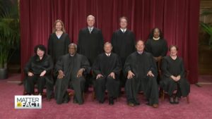 SCOTUS justices sitting down in their robes