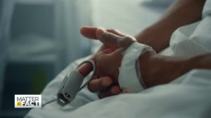 patient with pulse oximeter in hospital