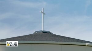 cross on the roof of a church